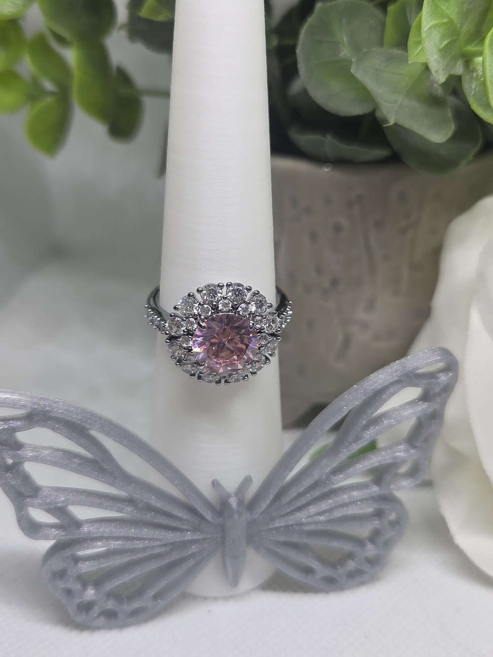 BP Rose Quartz Halo Ring with Clear Accent Stones On Rhodium Plating